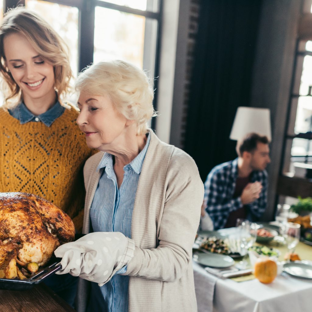 mother and daughter with thanksgiving turkey MMG Insurance